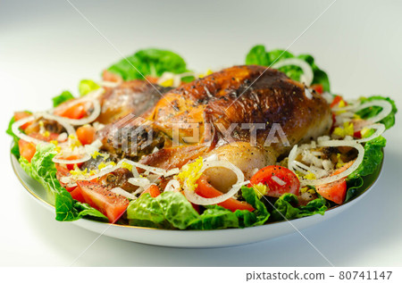 Roasted British large chicken with classic pork, sage, and onion stuffing served with little gem lettuce, tomato, and fresh onion Roasted British large chicken with classic pork, sage, and onion stuffing served with little gem lettuce, tomato, and fresh onion 80741147