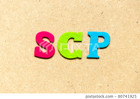 Color cloth alphabet letter in word SCP (Abbreviation of .Service control point, Supply chain planning, Standard corporate protocol or Salary continuation plan) on wood background 80741925