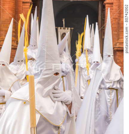 People participating in the Holy Week procession in a Spanish city during Easter 80742002