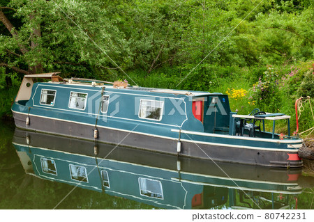 Narrowboat moored at canal in England UK Narrowboat moored at canal in England UK 80742231
