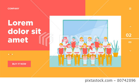 School students posing for class photo in classroom 80742896