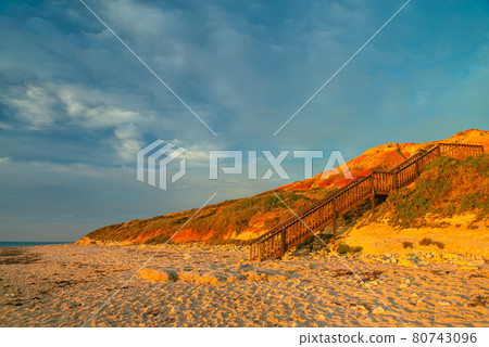 Boardwalk to Port Noarlunga South beach at sunset 80743096