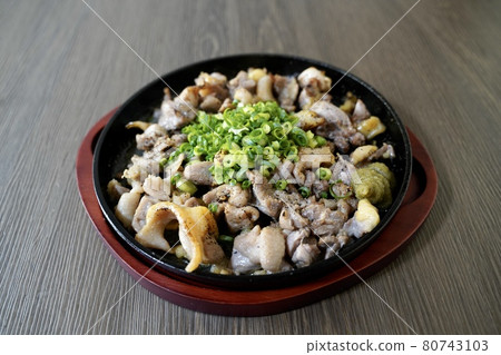 Charcoal grilling of local chicken 80743103