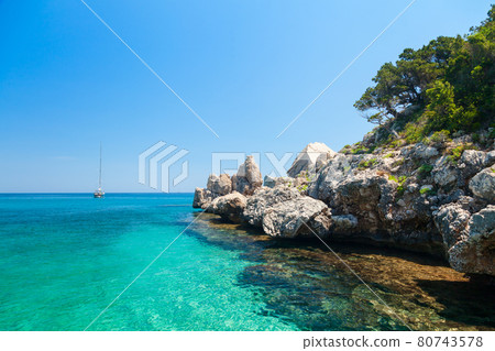 Clear turquoise water of Cala Luna in Sardinia Clear turquoise water of Cala Luna in Sardinia 80743578