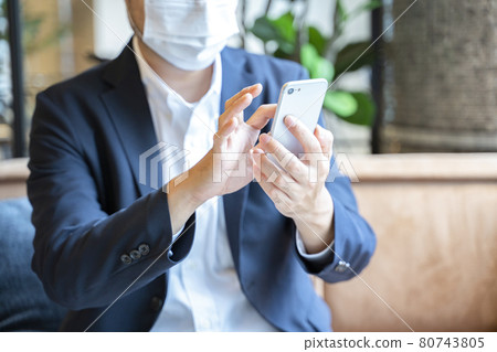Business scene: A man wearing a mask 80743805
