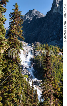 Waterfall cascading down a rocky mountain cliff in Canadian Nature Landscape. Waterfall cascading down a rocky mountain cliff in Canadian Nature Landscape. 80745231