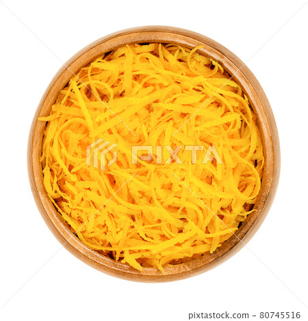 Fresh organic orange zest, orange peel strips, in a wooden bowl. Skin of ripe oranges, used for baking, or dried for tea blends. Close-up, from above, isolated on white background, macro food photo. Fresh organic orange zest, orange peel strips, in a wooden bowl. Skin of ripe oranges, used for baking, or dried for tea blends. Close-up, from above, isolated on white background, macro food photo. 80745516