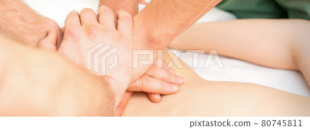 Woman receiving a back massage 80745811