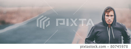 Runner running outside on road training endurance. Male athlete portrait panoramic banner. Man jogging 80745978