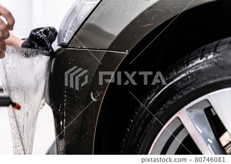 Installation of car transparent ppf foil in detailing studio 80746081