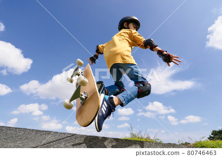 Boy jumping on a skateboard Boy jumping on a skateboard 80746463