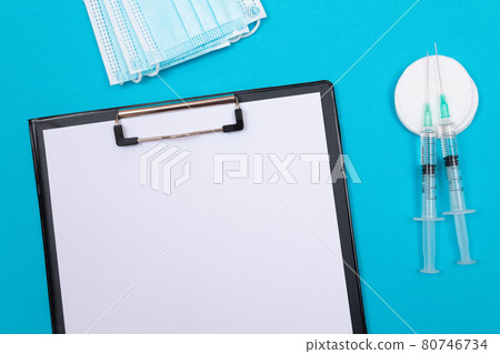 Vaccination or Revaccination Concept - Two Medical Syringe on Blue Table 80746734
