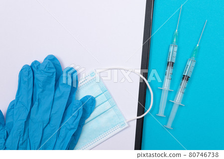 Vaccination or Revaccination Concept - Two Medical Syringe on Blue Table 80746738