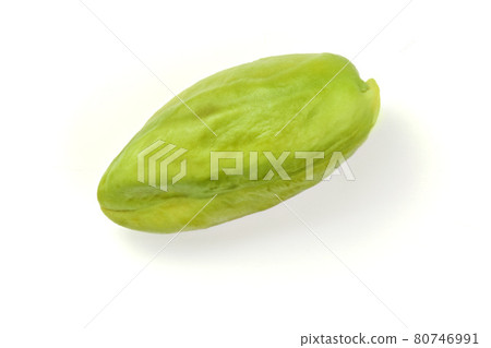Single green peeled pistachio isolated on white background. Single green peeled pistachio isolated on white background. 80746991