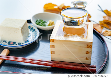Cold sake poured into a glass and a box Cold sake poured into a glass and a box 80748078