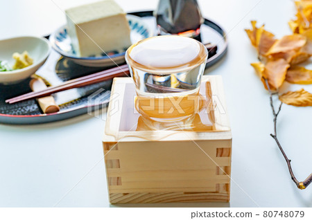 Cold sake poured into a glass and a box Cold sake poured into a glass and a box 80748079