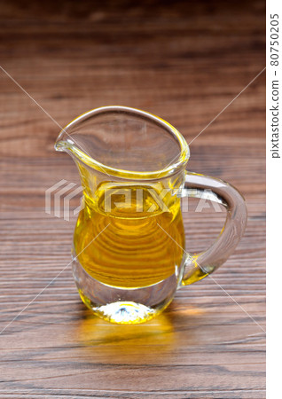 Extra virgin olive oil in a glassware. Extra virgin olive oil in a glassware. 80750205