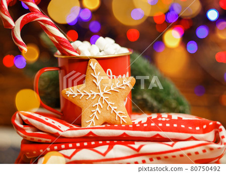 Composition with a cup and red blanket. Christmas hot drink 80750492
