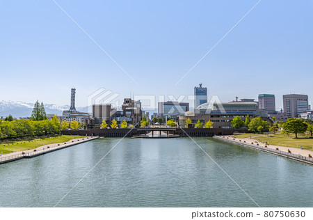 Toyama City, Toyama Prefecture The cityscape of Toyama seen from the clear Toyama Canal Kansui Park Toyama City, Toyama Prefecture The cityscape of Toyama seen from the clear Toyama Canal Kansui Park 80750630