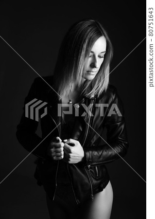 Portrait of a woman in a leather jacket and lingerie, black and white photo Portrait of a woman in a leather jacket and lingerie, black and white photo 80751643