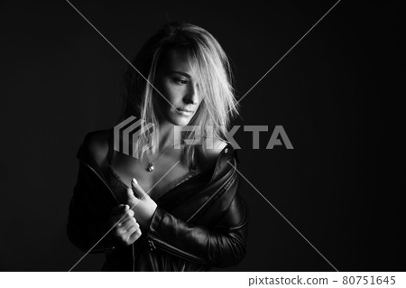 Portrait of a woman in a leather jacket and lingerie, black and white photo Portrait of a woman in a leather jacket and lingerie, black and white photo 80751645
