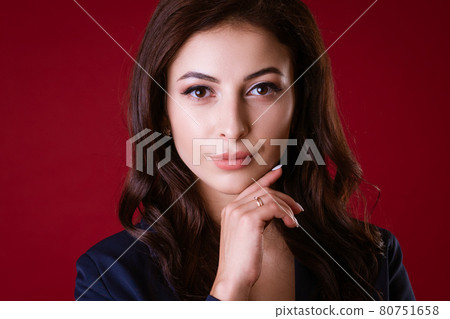 Business woman posing over red background Business woman posing over red background 80751658