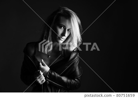 Portrait of a woman in a leather jacket and lingerie, black and white photo 80751659