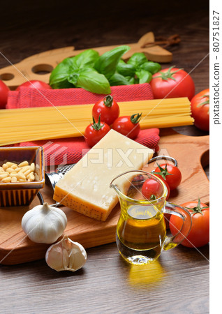 Image of cooking ingredients for Italian pasta. Parmigiano cheese, tomatoes, basil, olive oil, garlic Image of cooking ingredients for Italian pasta. Parmigiano cheese, tomatoes, basil, olive oil, garlic 80751827