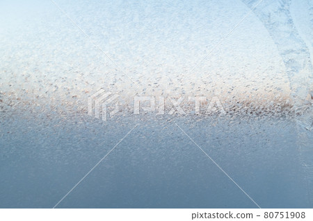 Fancy patterns drawn on a frosty winter day. Snow patterns on the glass. Frost texture from the ice crystals on the glass of the window, strong cold concept, horizontal image, copy space for your Fancy patterns drawn on a frosty winter day. Snow patterns on the glass. Frost texture from the ice crystals on the glass of the window, strong cold concept, horizontal image, copy space for your 80751908