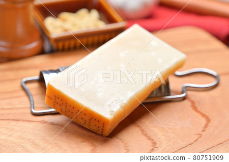 Italian ingredients cheese, Parmigiano Reggiano and cheese grater. 80751909