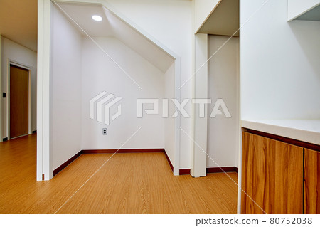 Table and dining table in a clean and simple modern open kitchen 80752038