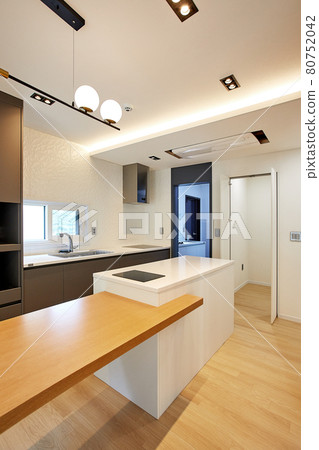 Table and dining table in a clean and simple modern open kitchen Table and dining table in a clean and simple modern open kitchen 80752042