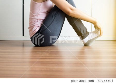 Woman receiving feet massaging and soles for plantar fasciitis Woman receiving feet massaging and soles for plantar fasciitis 80753301