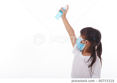 Cute Asian girl wearing a mask and washing her hands with alcohol to prevent spreading the disease on a white background. Prevention of the spread of influenza virus Coronary COVID-19 influenza Cute Asian girl wearing a mask and washing her hands with alcohol to prevent spreading the disease on a white background. Prevention of the spread of influenza virus Coronary COVID-19 influenza 80753528