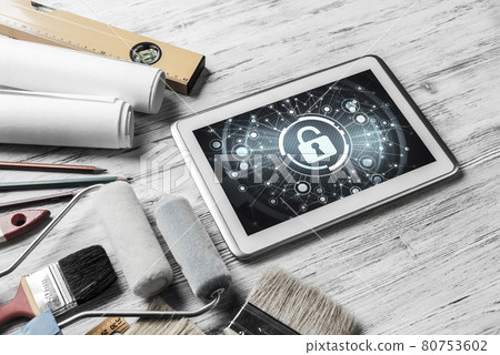 Web security and technology concept with tablet pc on wooden tab Web security and technology concept with tablet pc on wooden tab 80753602