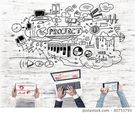 Top view of businesspeople sitting at table and using gadgets Top view of businesspeople sitting at table and using gadgets 80753793