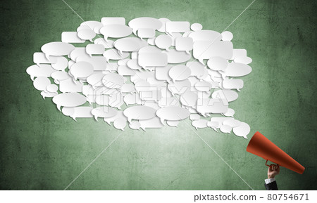 Hand of businesswoman holding red paper trumpet and speech cloud coming out 80754671