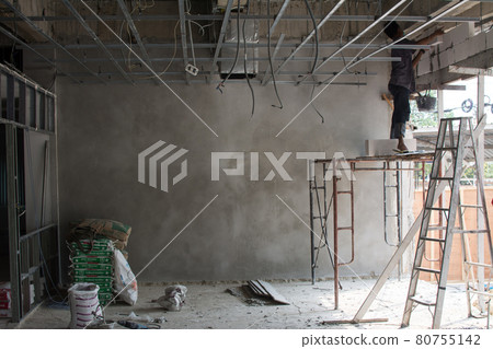 Interior construction site with worker 80755142