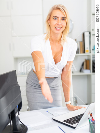 Businesswoman is going to meet visitors in her office Businesswoman is going to meet visitors in her office 80755646