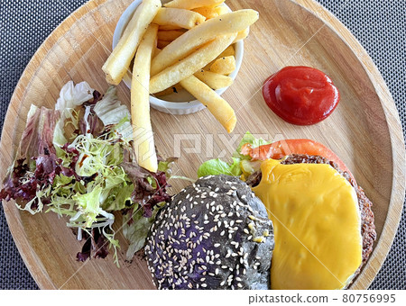 American food cheese hamburgar with fries and salad on the wooden tray 80756995