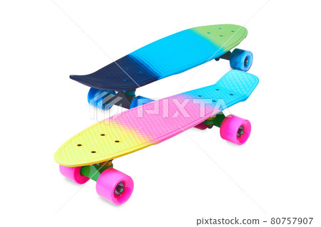Two rainbow plastic Penny board skateboards on white background Two rainbow plastic Penny board skateboards on white background 80757907