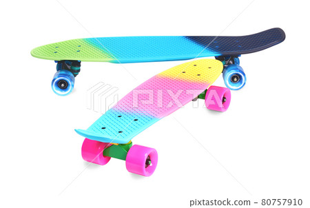 Two rainbow plastic Penny board skateboards on white background Two rainbow plastic Penny board skateboards on white background 80757910