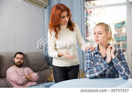 Mother comforting young daughter after a family conflict 80757937