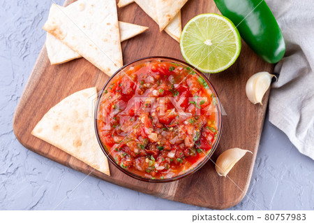 Traditional Tex-Mex cuisine salsa Asada sauce with roasted vegetables, served with tortilla chips and lime, horizontal, top view Traditional Tex-Mex cuisine salsa Asada sauce with roasted vegetables, served with tortilla chips and lime, horizontal, top view 80757983