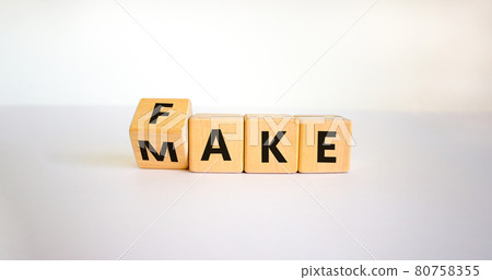Fake it until you make it symbol. Turned a cube and changed the word 'fake' to 'make'. Beautiful white background. Business, and fake it till you make it concept. Copy space. Fake it until you make it symbol. Turned a cube and changed the word 'fake' to 'make'. Beautiful white background. Business, and fake it till you make it concept. Copy space. 80758355