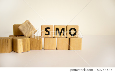 SMO, social media optimization symbol. Wooden cubes with word 'SMO - social media optimization' on beautiful white background, copy space. Business, SMO - social media optimization concept. 80758387