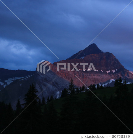 Red lit peak of Mount Oldehore, mountain in the Swiss Alps. Red lit peak of Mount Oldehore, mountain in the Swiss Alps. 80758389
