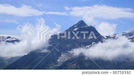 Peak of Mount Oldehore surrounded by clouds. 80758392