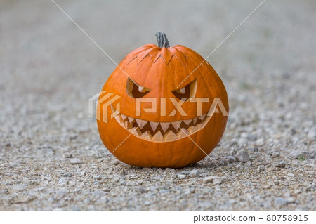 Scary smiling halloween pumpkin nasty face ground 80758915