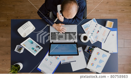 Top view of manager man planning company strategy typing management statistics 80758983